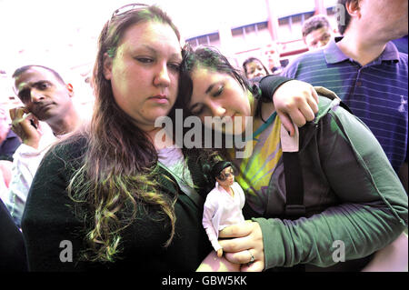 Michael Jackson fans, Donna Kelly Jackson (left) who is 23 today and Terri Day, 16, both from Fulham, outside the Lyric Theatre in London following the death of singer Michael Jackson.