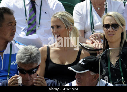 Bec Cartwright watches her husband Lleyton Hewitt in action during the 2009 Wimbledon Championships at the All England Lawn Tennis and Croquet Club, Wimbledon, London. Stock Photo