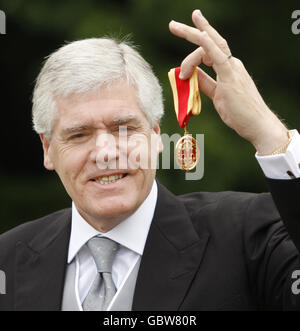 Sir Alexander Crombie, Group Chief Executive of Standard Life with his knighthood after it was presented to him by Queen Elizabeth II at the Palace of Holyrood House, Edinburgh, Scotland. Stock Photo