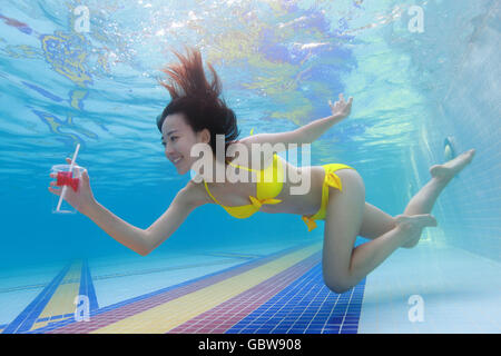 Young woman swimming in the water Stock Photo