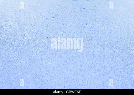 Background light blue tin sheet with water drops in the backlight Stock Photo