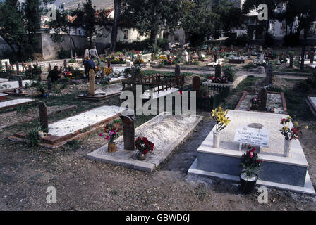 events, Bosnian War 1992 - 1995, Mostar, cemetary with one year old graves, 1994, grave, death, Bosnia-Herzegovina, Bosnia - Herzegovina, destruction, destroyed bridge, flag, Yugoslavia, Yugoslav Wars, Balkans, conflict, people, 1990s, 90s, 20th century, historic, historical, Additional-Rights-Clearences-Not Available Stock Photo