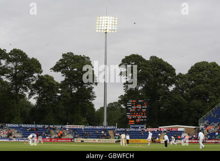 Australia's Michael Clarke and Marcus North bat under floodlights as England's Andrew Flintoff bowls during day three of the first npower Test match at Sophia Gardens, Cardiff. Stock Photo