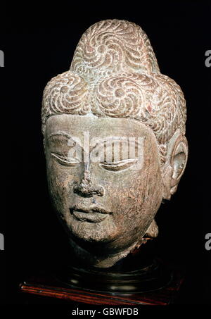 fine arts, China, sculpture, head of a Buddha, brown hardstone, Lungmen diction, perhaps Sung dynasty (960-1279), probably still Tang dynasty (618-906), height: 32 cm, private collection, Stock Photo