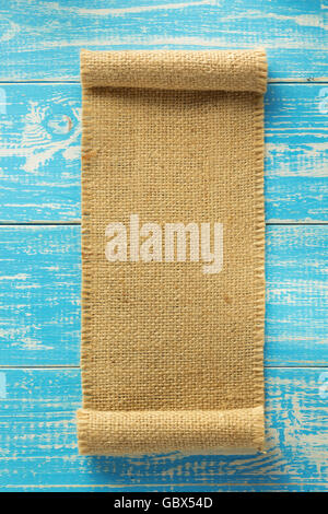 burlap hessian sacking on wooden background Stock Photo