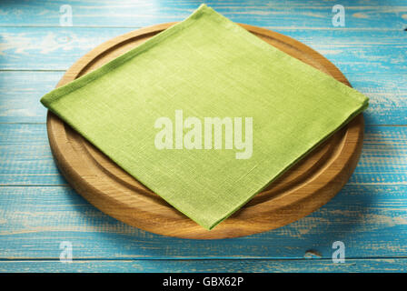 napkin at cutting board on wooden background Stock Photo