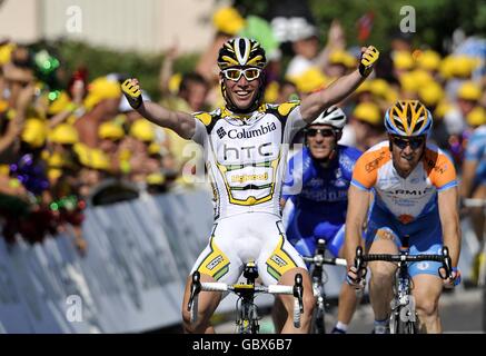 Mark Cavendish crosses the line to win the second stage of the Tour de France between Monaco and Brignoles. Stock Photo