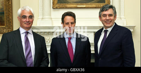 US Treasury Secretary Timothy Geitner (centre) is greeted by Prime Minister Gordon Brown (right) and Chancellor of the Exchequer Alistair Darling (left) ahead of meetings at Downing Street in London. Stock Photo
