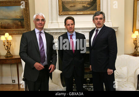 US Treasury Secretary Timothy Geitner (centre) is greeted by Prime Minister Gordon Brown (right) and Chancellor of the Exchequer Alistair Darling (left) ahead of meetings at Downing Street in London. Stock Photo