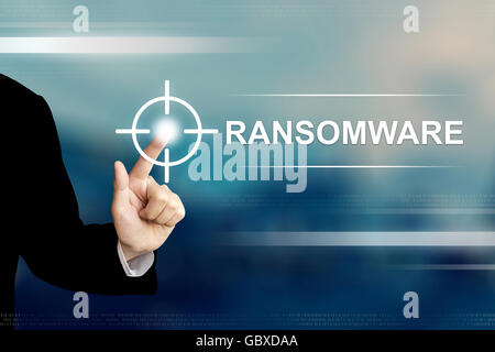 business hand pushing ransomware button on a touch screen interface Stock Photo