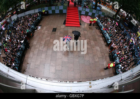 The crowd during heavy rain at the world premiere of Harry Potter and the Half-Blood Prince at the Odeon Leicester Square, London. Stock Photo