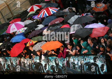 The crowd during heavy rain at the world premiere of Harry Potter and the Half-Blood Prince at the Odeon Leicester Square, London. Stock Photo