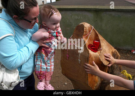 Virgin Mary seen in tree stump Stock Photo