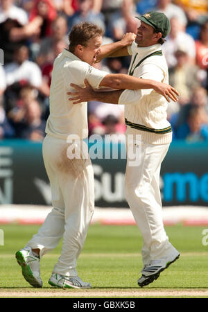 Australia's Nathan Hauritz celebrates with captain Ricky Ponting (right) after dismissing England's Stuart Broad during day Five of the first npower Test match at Sophia Gardens, Cardiff. Stock Photo