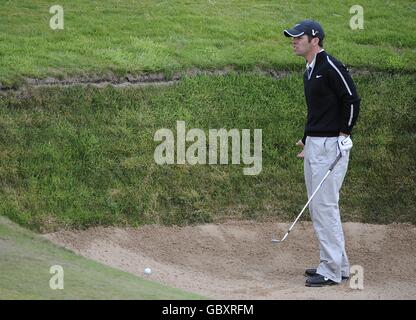 England's Paul Casey works out how to hit the ball out of a ssand bunker during the second day of the Open Championship at Turnberry Golf Club.