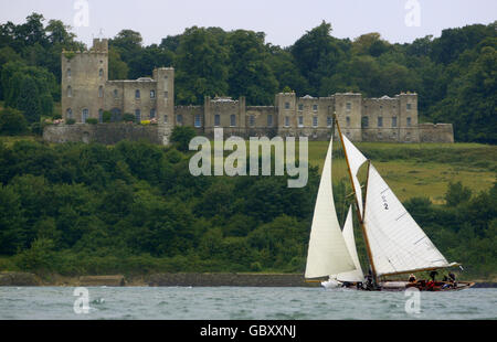 Kelpie, competing in the British Classic Yacht Club regatta passes Norris Castle in Osborne Bay during racing on The Solent near Cowes, Isle of Wight. Stock Photo
