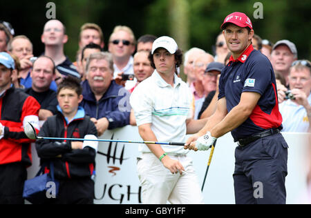 Ireland's Padraig Harrington (right) and opponent, Northern Ireland's Rory McIlroy (behind) during the Laugh Erne Challenge at Laugh Erne resort, Fermanagh, Northern Ireland. Stock Photo