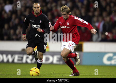 Nottingham Forest's Kris Commons (r) goes past Rotherham United's Paul Warne Stock Photo