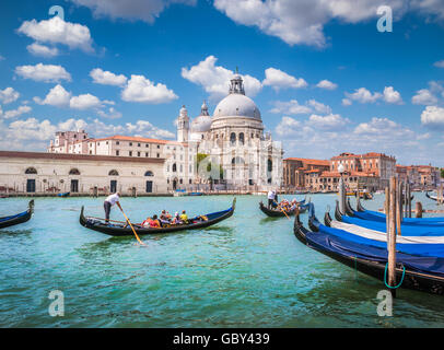 Traditional Gondolas on Canal Grande with historic Basilica di Santa Maria della Salute in the background, Venice, Italy Stock Photo