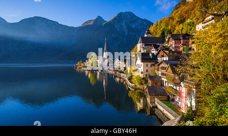 Scenic picture-postcard view of famous Hallstatt mountain village with Hallstaetter Lake in the Alps in fall at sunrise, Austria Stock Photo