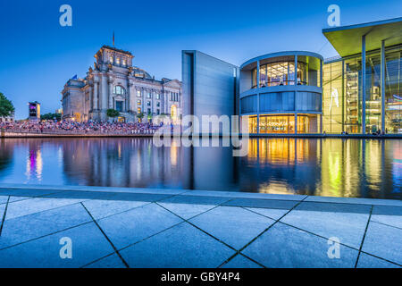 Classic view of modern Berlin government district with famous Reichstag building and Paul Lobe Haus in twilight, Berlin, Germany