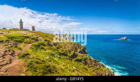 Scenic coastal landscape with traditional lighthouse at famous Cap Frehel peninsula on the Cote d'Emeraude, Bretagne, France Stock Photo