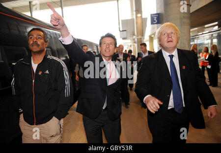 (Left to right) Former Olympic athlete Daley Thompson, Lord Coe and London Mayor Boris Johnson arrive on the high speed Javelin train at Stratford Station where they will view ongoing construction work at the Olympic stadium in east London. Stock Photo