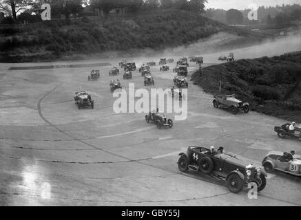 Motor Racing - Brooklands. A crowd of cars in a race at Brooklands. Stock Photo