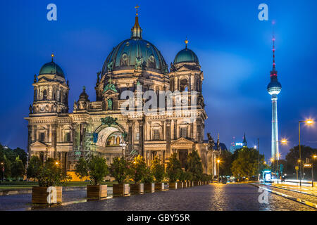 Berlin Cathedral with famous TV tower in the background in twilight during blue hour at dusk, Berlin Mitte district, Germany Stock Photo