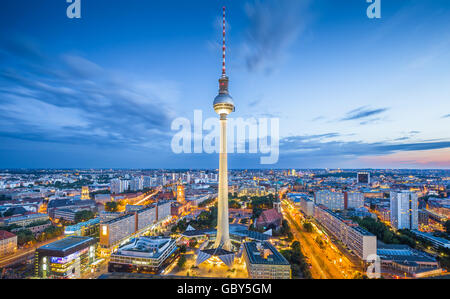 Aerial classic view of Berlin skyline with famous TV tower at Alexanderplatz and dramatic cloudscape in twilight, Germany Stock Photo