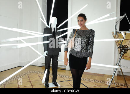 Amber Le Bon is seen with a suit designed by Versace and James Clar at the Esquire Singular Suit Launch Party at Somerset House, in London. Stock Photo