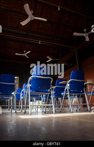 Desks are unoccupied at a new English language school in Chork village, Cambodia. Stock Photo