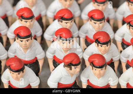 ´Caganers´, particular feature of modern nativity scenes at Santa Llucia Christmas fair, Barcelona. Catalonia, Spain. Stock Photo
