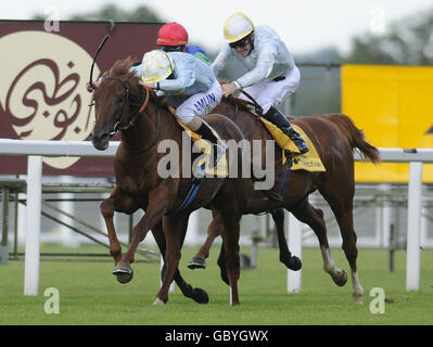 Conduit and Ryan Moore win The King George VI and Queen Elizabeth Stakes during The Betfair Weekend at Ascot Racecourse, Berkshire. Stock Photo