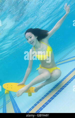 Young woman swimming in the water Stock Photo