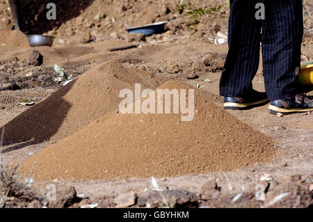 wild golden Koupela mine, the gold diggers come from everywhere to dig, a pile of dirt already gone in search of gold Stock Photo