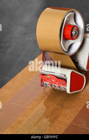 Taping box with a tape dispenser Stock Photo