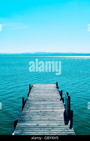 view of a wooden dock over the lagoon in the Albufera de Valencia, in Valencia, Spain Stock Photo