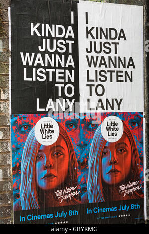I kinda just wanna listen to Lany Little White Lies posters on wall at Shoreditch, London in July Stock Photo