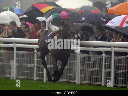 Horse Racing - Glorious Goodwood - Day Five - Goodwood. Midday and Tom Queally win The Blue Square Nassau Stakes during the Glorious Goodwood Festival at Goodwood racecourse, Chichester. Stock Photo