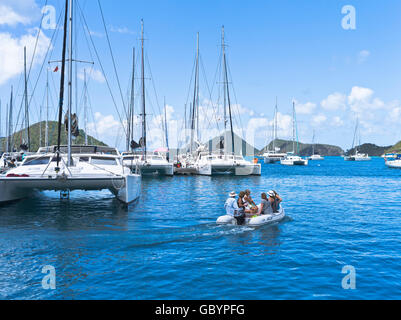 dh Sopers hole TORTOLA CARIBBEAN Yacht marina luxury catamarans people inflatable dinghy boat holiday Stock Photo