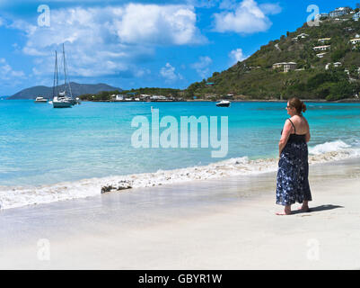 dh Cane Garden Bay TORTOLA CARIBBEAN Woman tourist blue sea sky sand beach Stock Photo