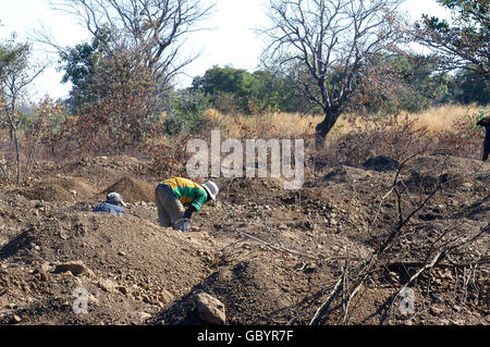 mine in wild golden Poura gold diggers come from everywhere to dig for gold nuggets with simple bowls Stock Photo