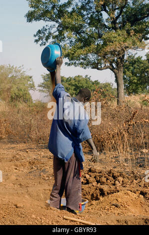 mine in wild golden Poura gold diggers come from everywhere to dig for gold nuggets with simple bowls Stock Photo