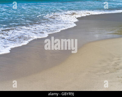 dh Brewers Bay beach TORTOLA CARIBBEAN Sea waves lapping shore sand beach Stock Photo