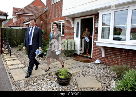 Conservative Party Parliamentary candidate Chloe Smith and shadow Chancellor George Osborne canvass on the streets of Taverham, Norwich, Norfolk, ahead of the North Norwich by-elections in the city. Stock Photo