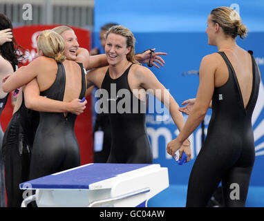 British swimmer Rebecca Adlington is hugged by Caitlin McClatchey, with Jazmin Carlin and Joanne Jackson after winning the bronze medal in the Women's 4 x 200m Freestyle final during the FINA World Swimming Championships in Rome, Italy. Stock Photo