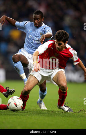 Soccer - Carling Cup - Third Round - Manchester City v Arsenal. Manchester City's Bradley Wright-Phillips and Arsenal's Francesc Fabregas Stock Photo