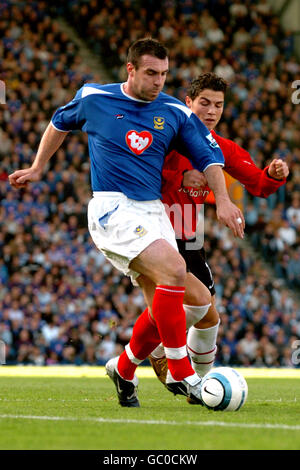 Portsmouth's David Unsworth and Manchester United's Cristiano Ronaldo battle for the ball Stock Photo