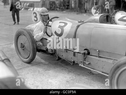 Mark Pepys, the Earl of Cottenham, driver of car 3, at Brooklands during the 200 Mile Race. He is seen wearing a steel helmet. Stock Photo